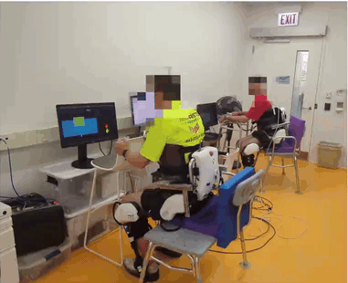 Exoskeleton-Mediated Physical Human-Human Interaction for a Sit-to-Stand Rehabilitation Task